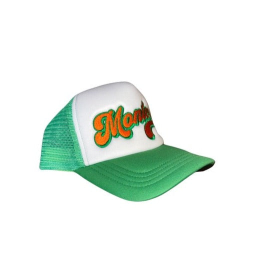 Montee’s Trucker Hat – Streetwear-inspired hat with mesh back and bold front logo. Perfect for adding an edge to any casual look. Side